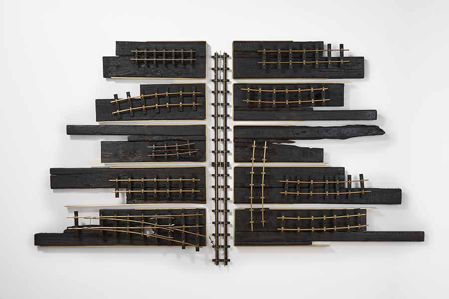LR Vandy, Railway, no., 2019. Charred wood and brass, 100 x 160 x 10 cm. Photo: Matthew Booth