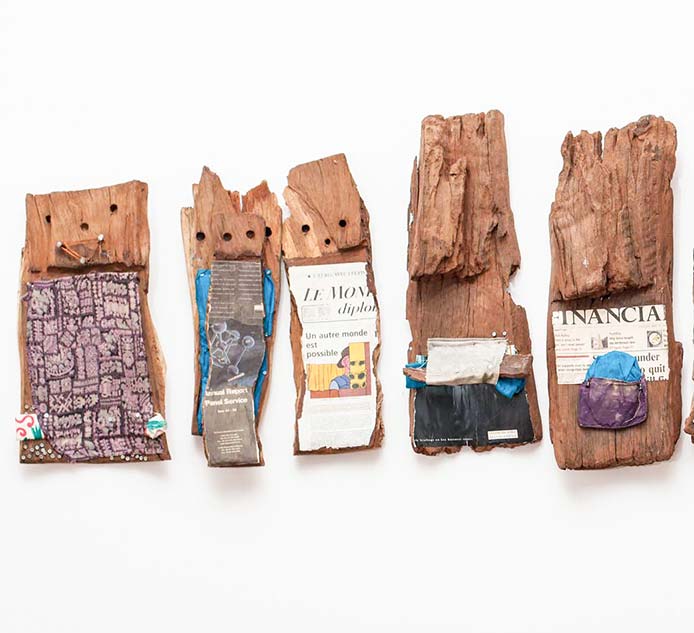 El Anatsui, Well Informed Ancestors (detail), 1998. Tropical hardwoods and mixed media, 58 x 225 x 13 cm. 