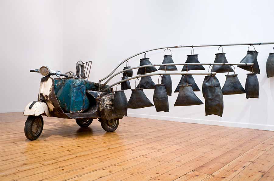 Romuald Hazoumè, Water Cargo, 2012. Mixed media installation, 175 x 550 x 320 cm. Romuald Hazoumè, Water Cargo, 2012. Mixed media installation, 175 x 550 x 320 cm.