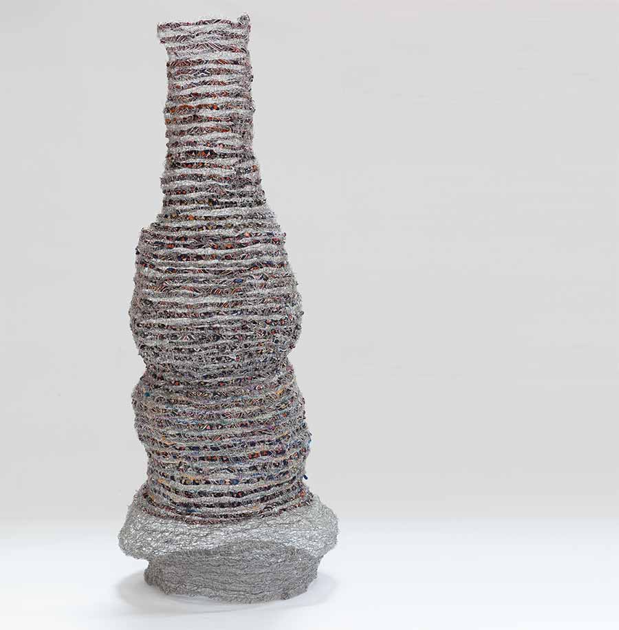 Naomi Wanjiku Gakunga, Rainy Season, 2010. Crocheted and woven stainless steel wire, fabric and galvanised wire, 74 x 31 x 23 cm. Naomi Wanjiku Gakunga, Rainy Season, 2010. Crocheted and woven stainless steel wire, fabric and galvanised wire, 74 x 31 x 23 cm.