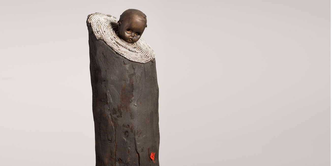 Gérard Quenum, La bonne bergère (The Good Sheperdess), 2012. Wood, metal, beads and plastic doll, 169 x 56 x 28 cm.
