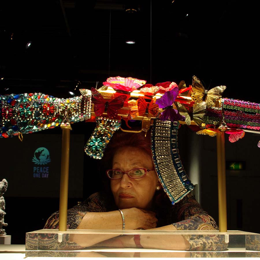 <strong>Laila Shawa</strong>,  with <em>Where Souls Dwell</em> (AK47 Gun). Photo: © Malcolm Crowthers.
