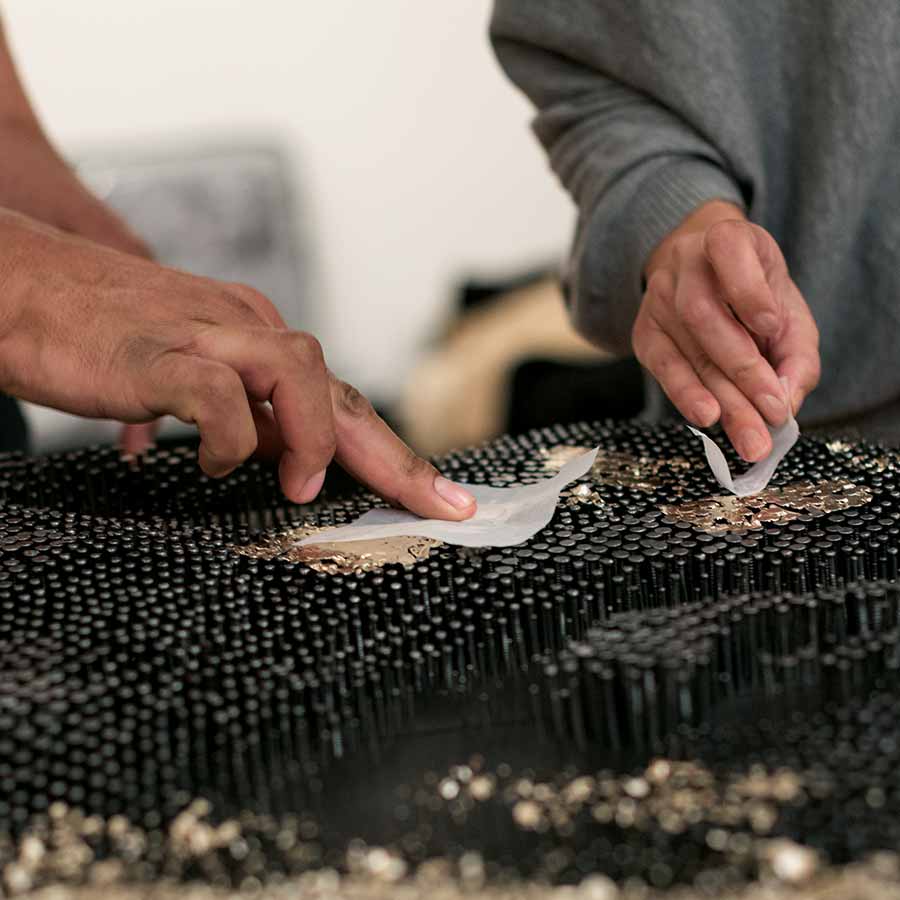 Alexis Peskine and assistant at work gilding nail heads, October Gallery. Photo: © Jonathan Greet.