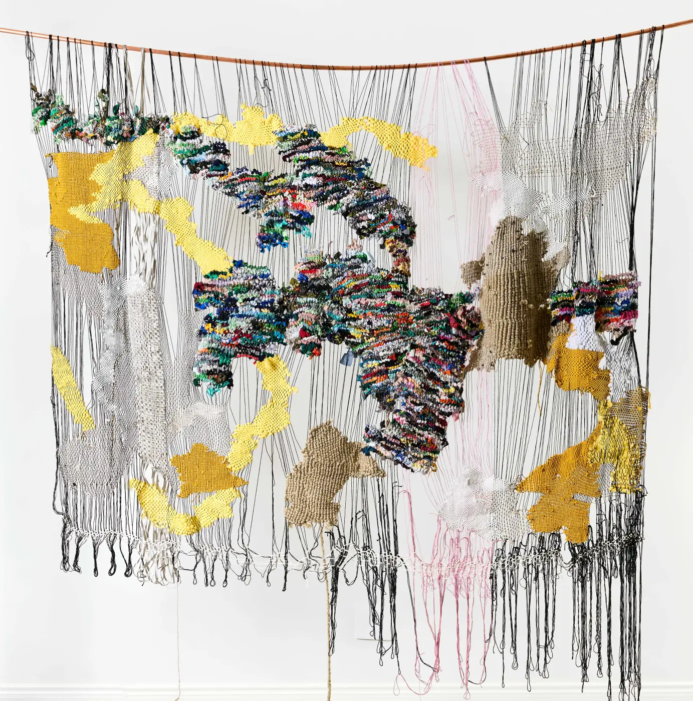 Bev Butkow, never static, 2022.Wool, dressmaking scraps, string, ribbon, twine, copper rod, time and labour. Made with Thandiswa Maxinyane and Danily Hunga.. 170 x 250 cm. 