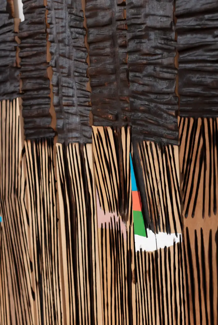 El Anatsui, Novisi, 2024. Tropical hardwood and tempera, 159 x 376 cm. (detail opposite) 